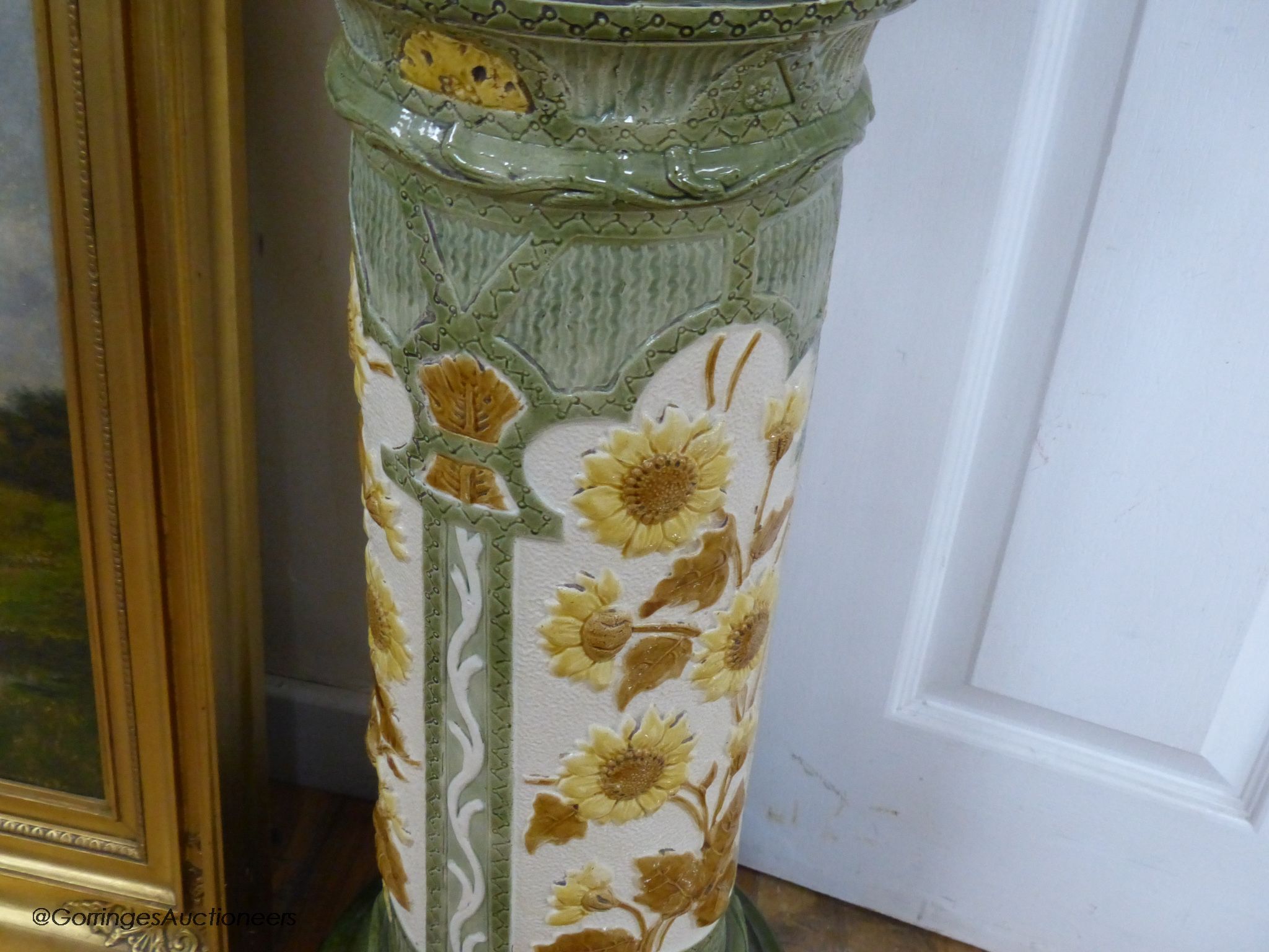 A Burmantofts faience jardiniere on pedestal, 105cm high